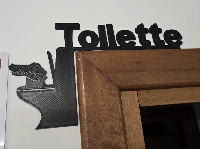 Alligatore TOILETTE scritta sopra porta