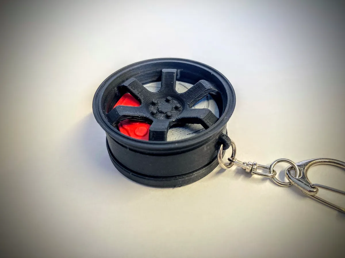 Wheel Keychain Airtag Holder by Inventor Coral MakerWorld: Download Free 3D Models - 3D model önizlemesi