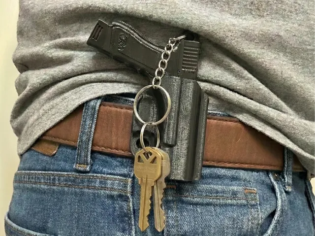 The QuickDraw Keychain - Mini Pistol & Holster