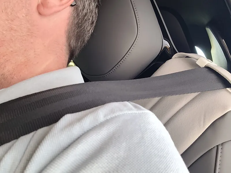 Seat belt away from neck holder