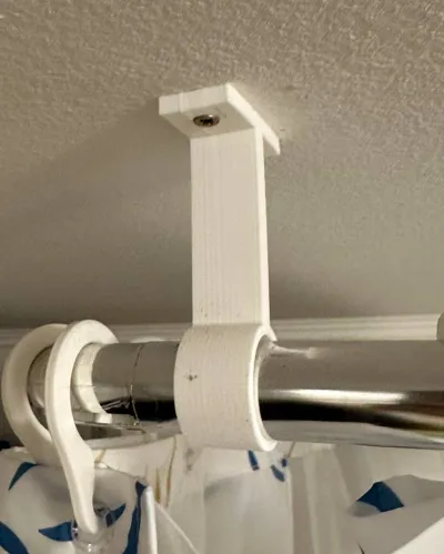 Shower curtain rod to wall fixation