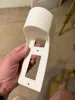 Outlet cover with cord storage